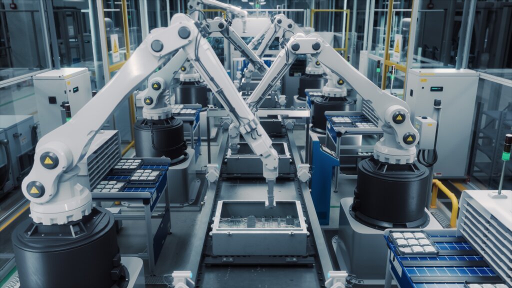 Industrial assembly line with robotics, and supporting electrical infrastructure on the factory floor.