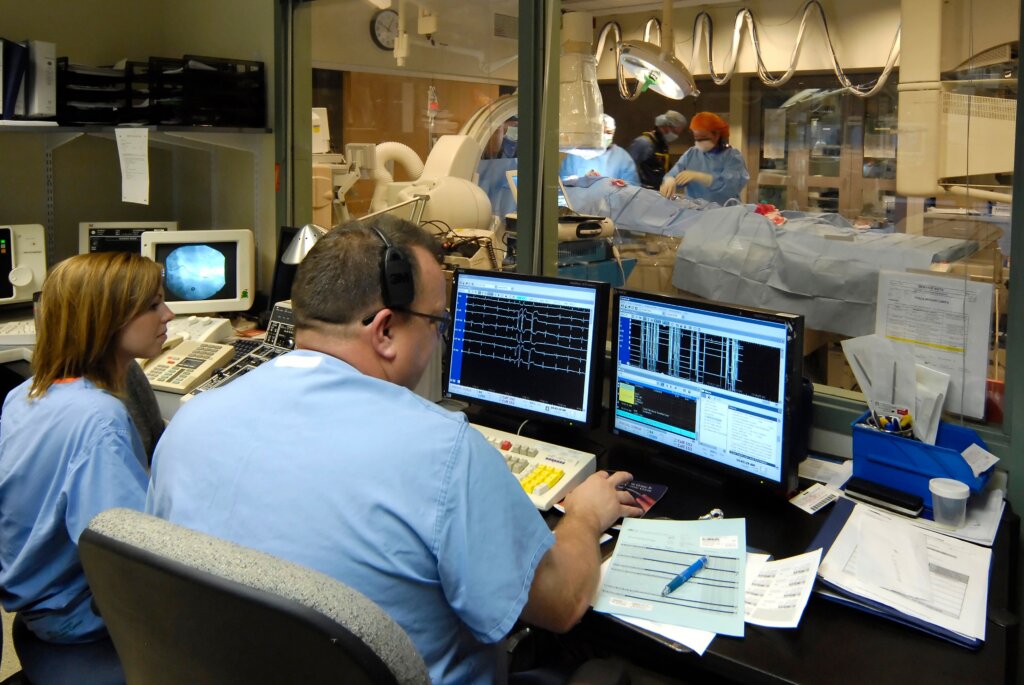 Medical technicians monitoring a life-saving surgical procedure.