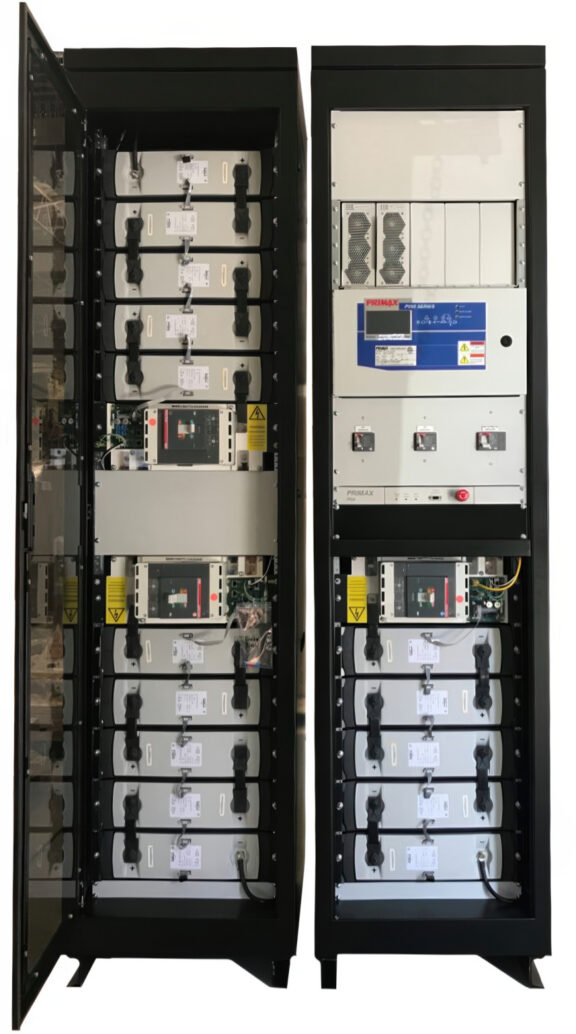 Two tall electrical cabinets opened to reveal battery modules and power electronics inside a data-center-style enclosure